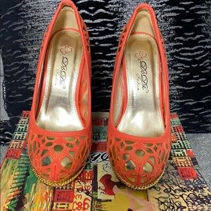 Orange and gold pumps